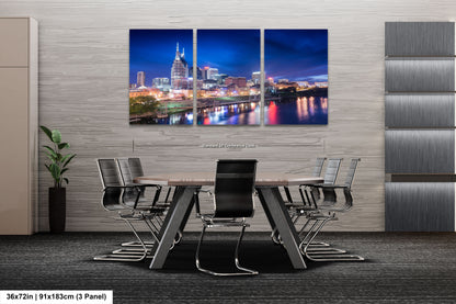 a dining room table with a view of a city at night