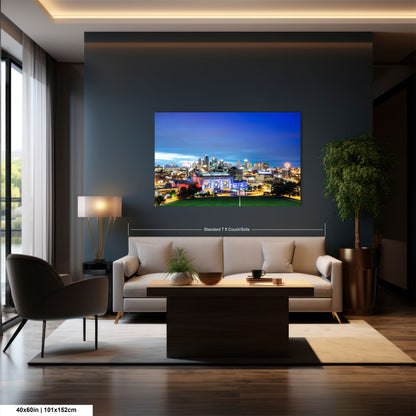 a living room with a large picture on the wall