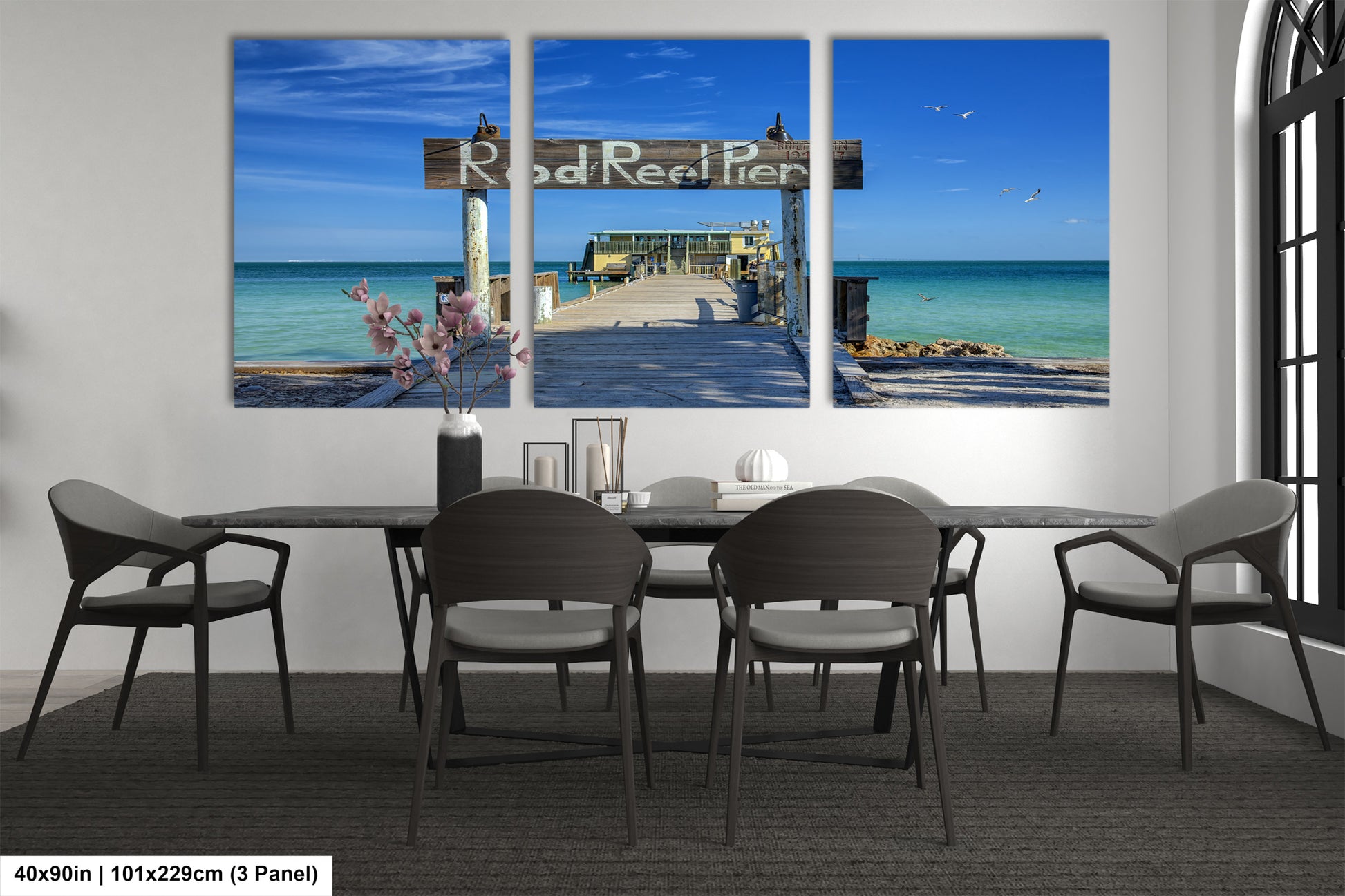 a dining room with a table and four chairs