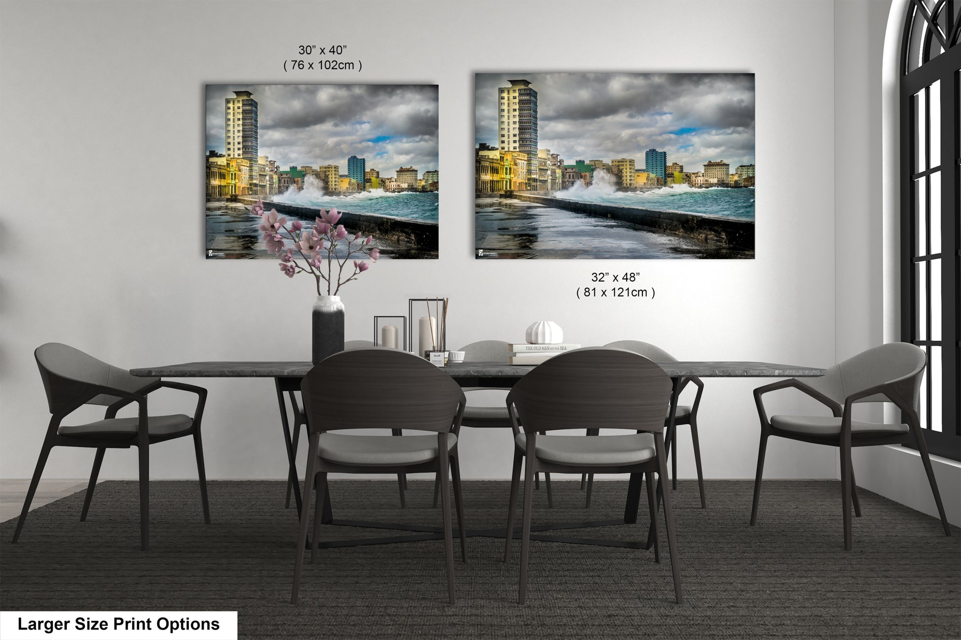 a dining room table with chairs and a vase of flowers