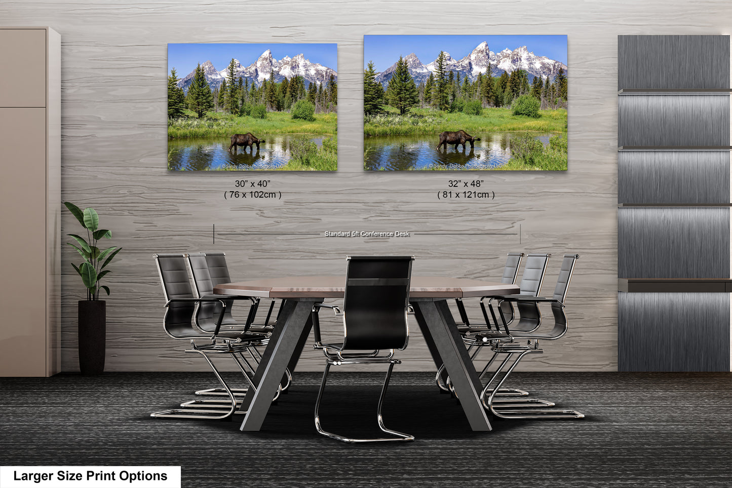 a dining room table with chairs in front of a wall with two pictures of mountains