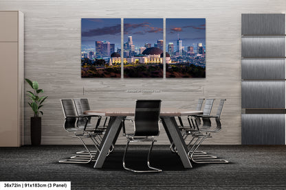 a dining room with a table and chairs with a city skyline in the background
