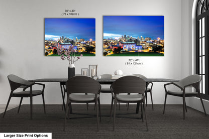 a dining room table with four chairs and a picture of a city