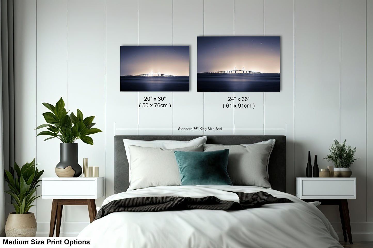 a bedroom with a bed and two pictures on the wall