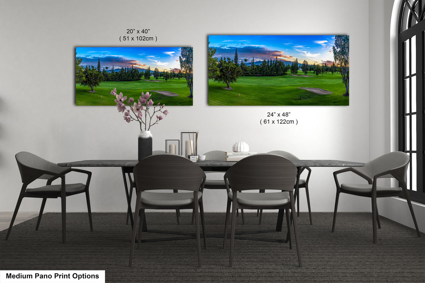 a dining room table with four chairs and a vase of flowers