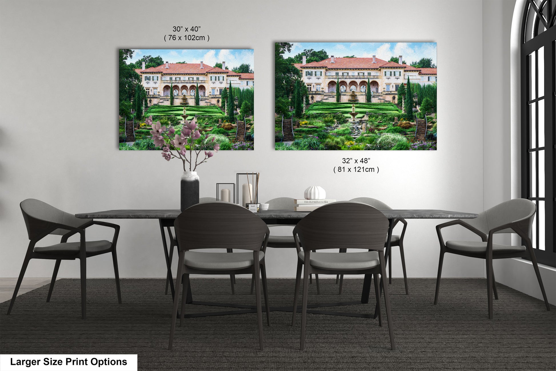a dining room table with four chairs and a vase of flowers