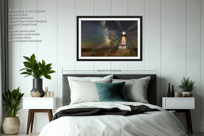 a bedroom with a large bed and a picture on the wall