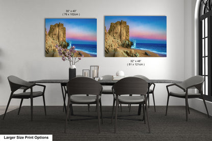 a dining room table with four chairs and a painting on the wall