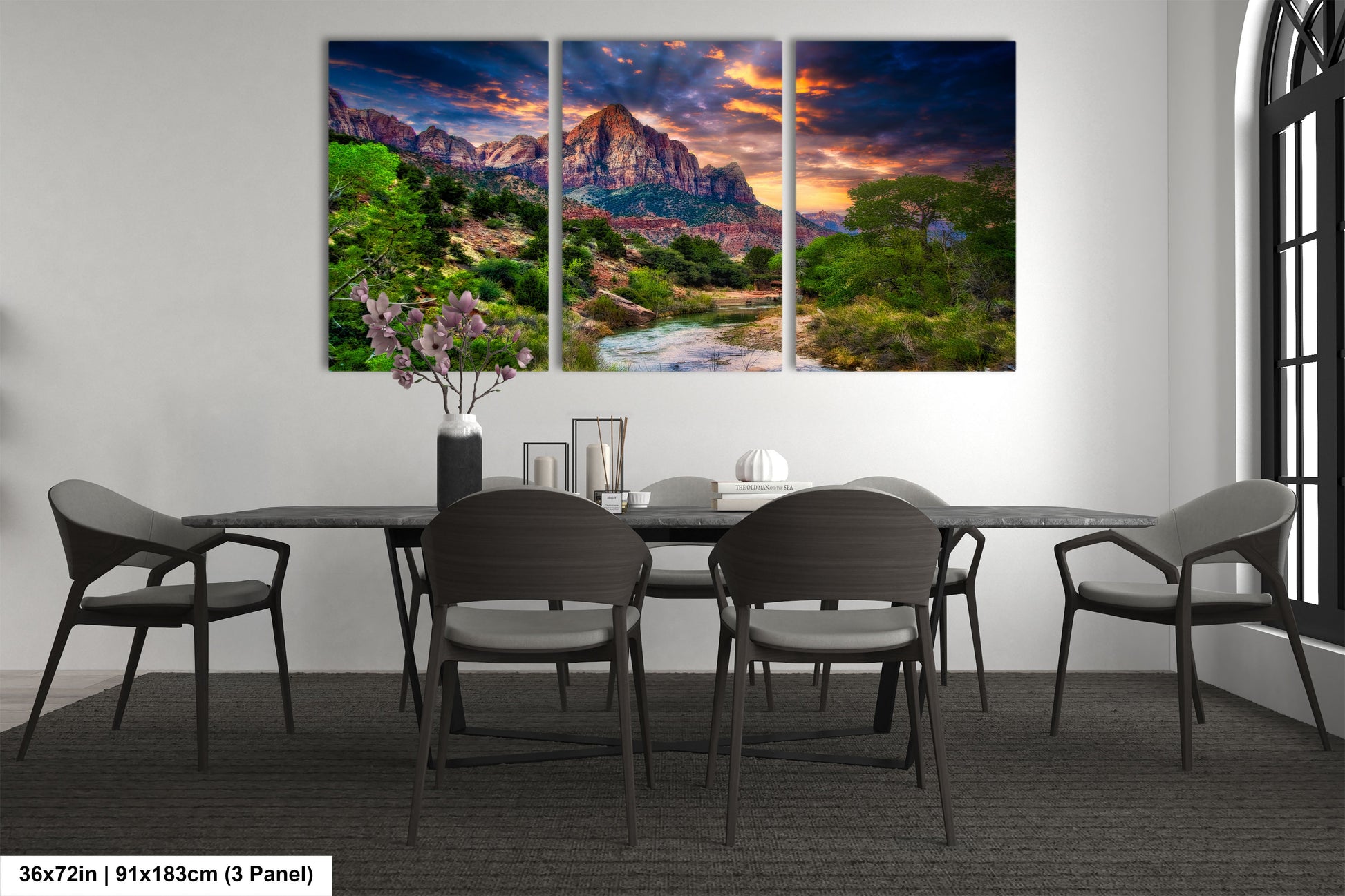 a dining room table with chairs and a painting on the wall