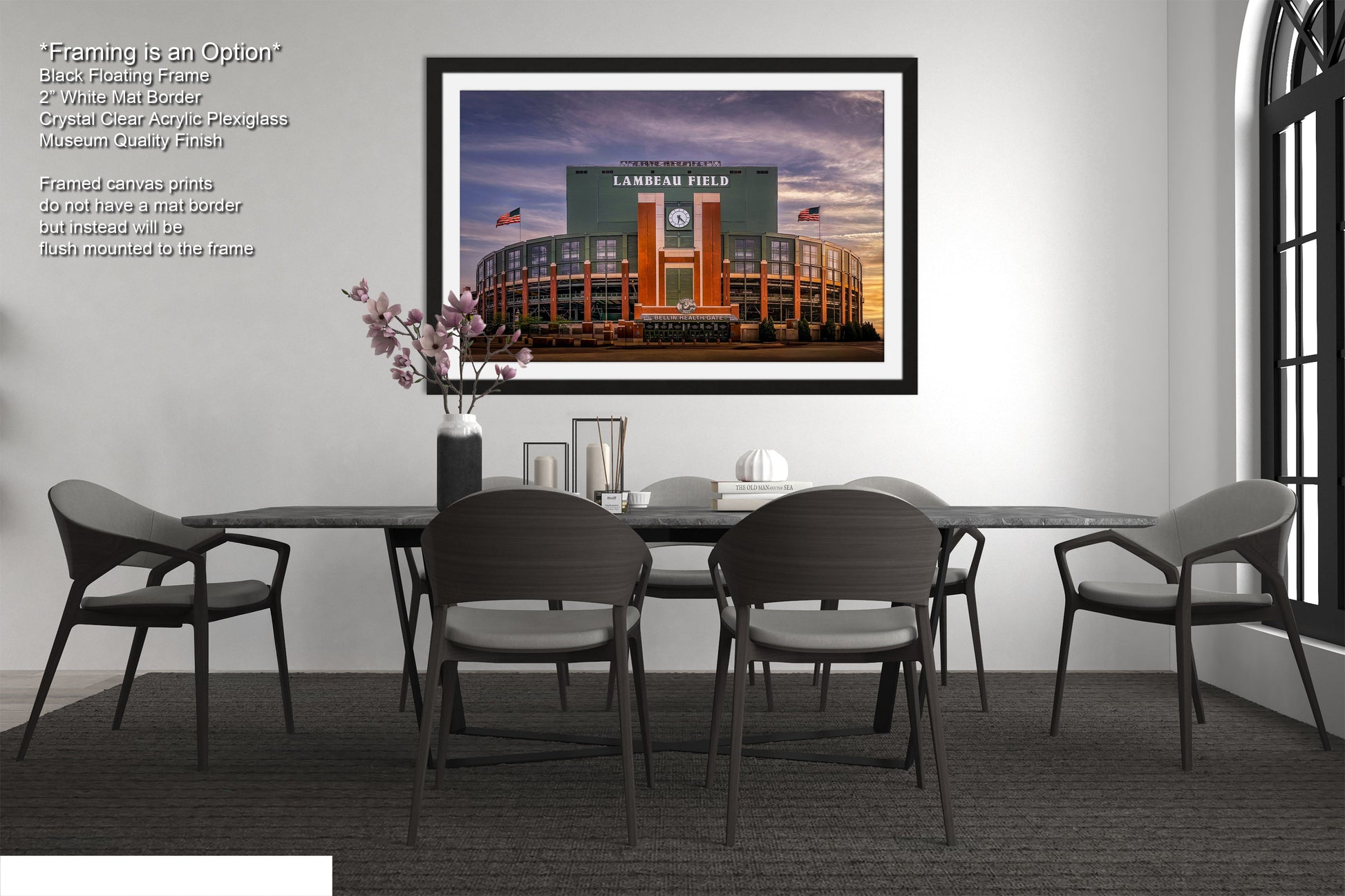 a dining room table with chairs and a picture hanging on the wall