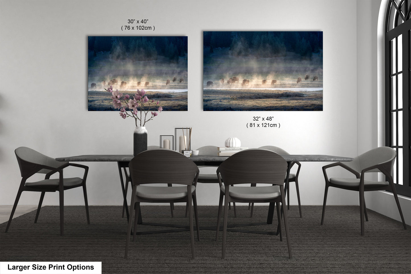 a dining table with four chairs and a vase of flowers