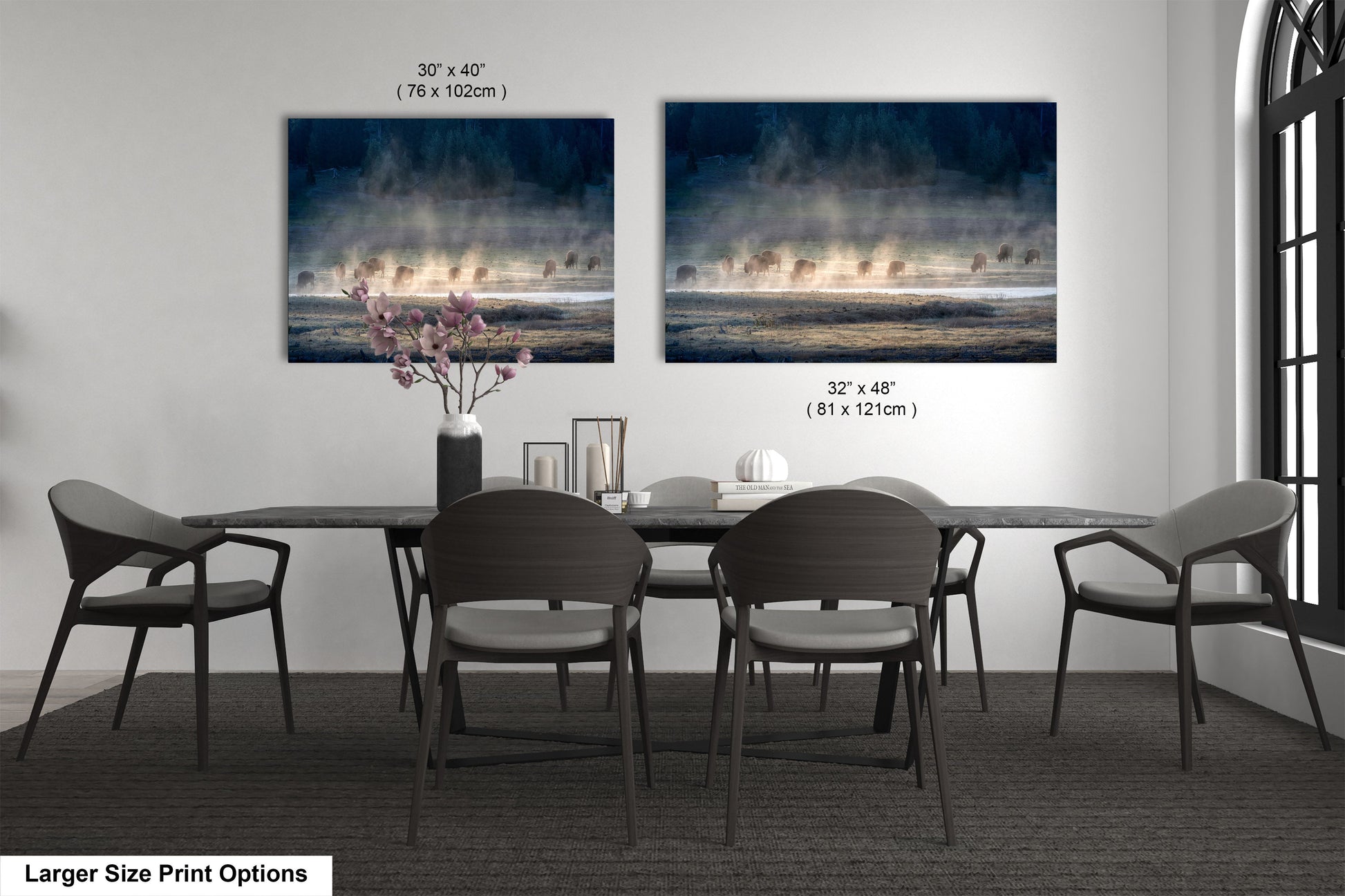 a dining table with four chairs and a vase of flowers
