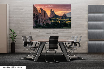 a dining room table with chairs and a painting on the wall