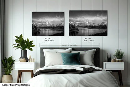 a bedroom with a bed and two pictures on the wall