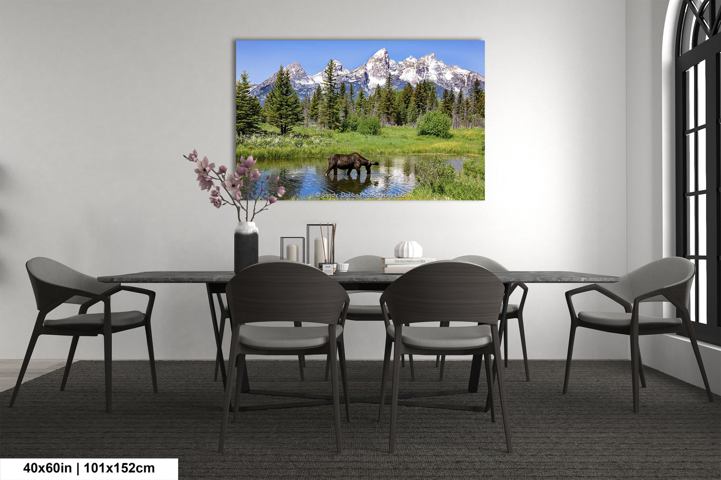 a dining room with a table and chairs