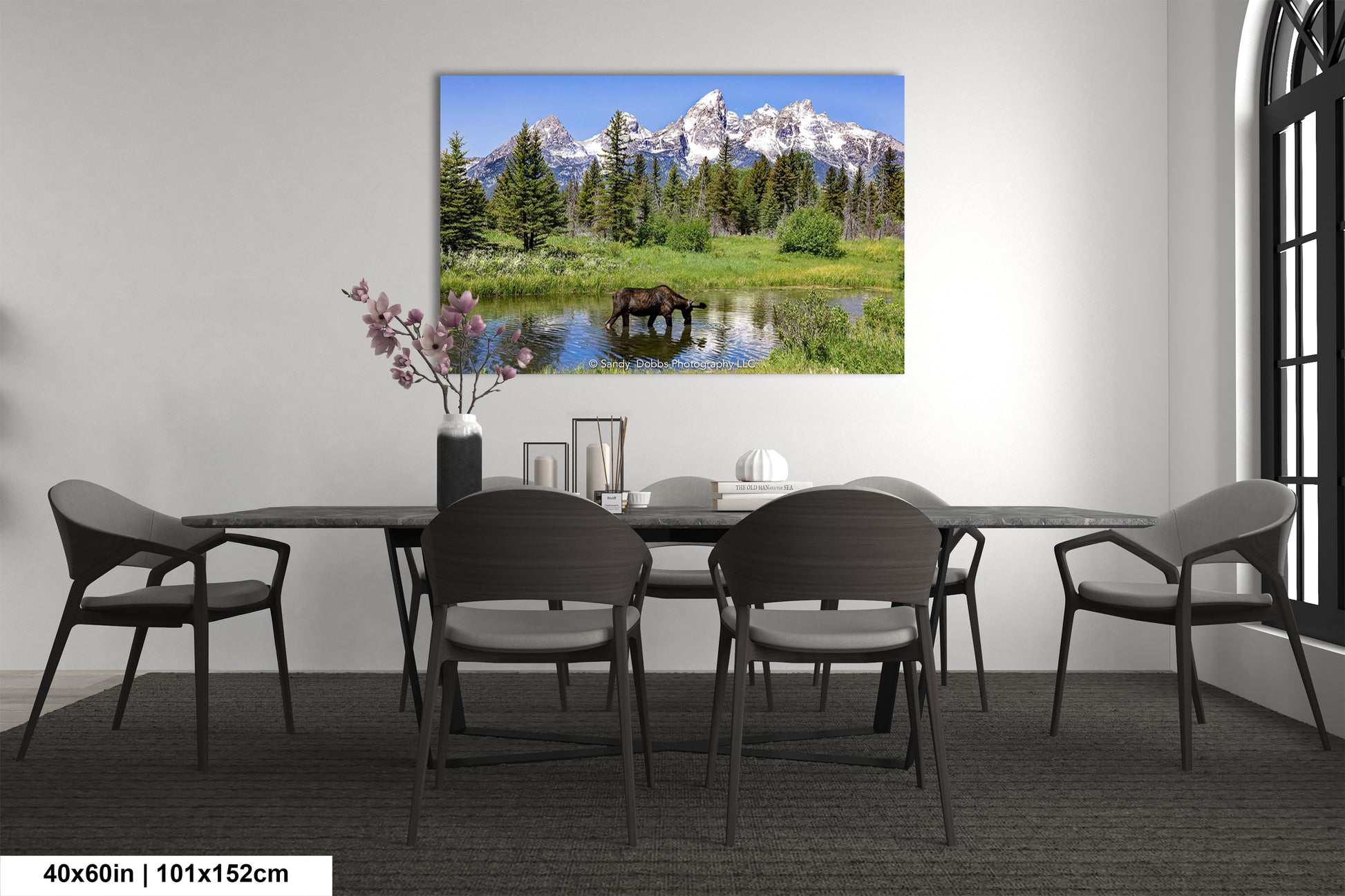 a dining room with a table and chairs