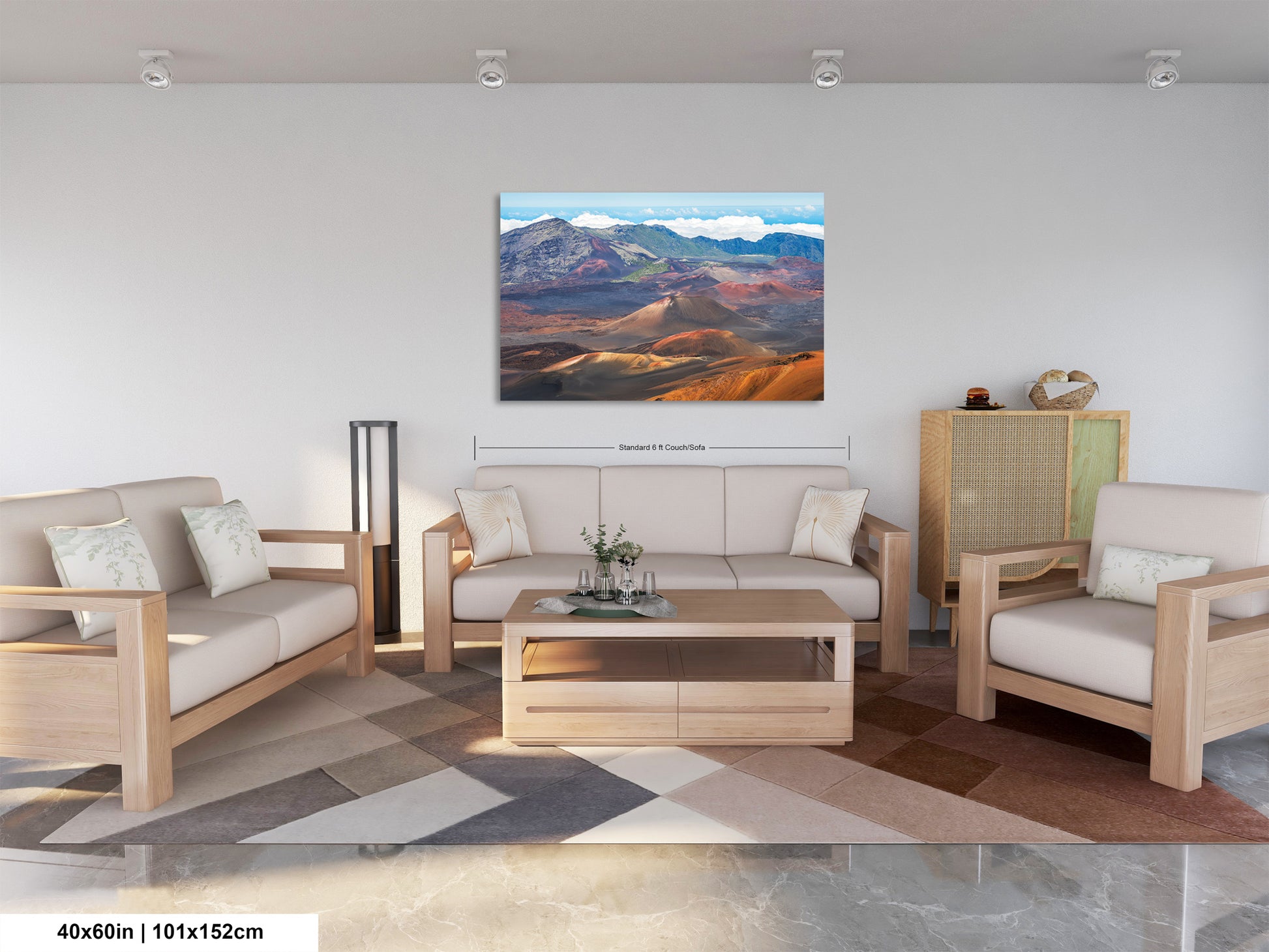 a modern living room with a large landscape painting hanging on the wall. The painting features a mountainous, desert-like scene with a mix of red, orange, and blue colors. The room is furnished with a sofa, two armchairs, and a coffee table, creating a comfortable and inviting atmosphere.