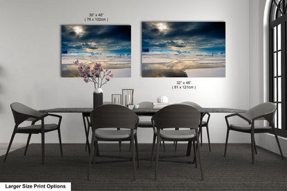 a dining table with four chairs and a vase of flowers