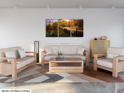 The image is a modern living room with a large, colorful painting of a scenic landscape hanging on the wall. The room is furnished with a sofa, two chairs, and a coffee table, creating a comfortable and inviting atmosphere.