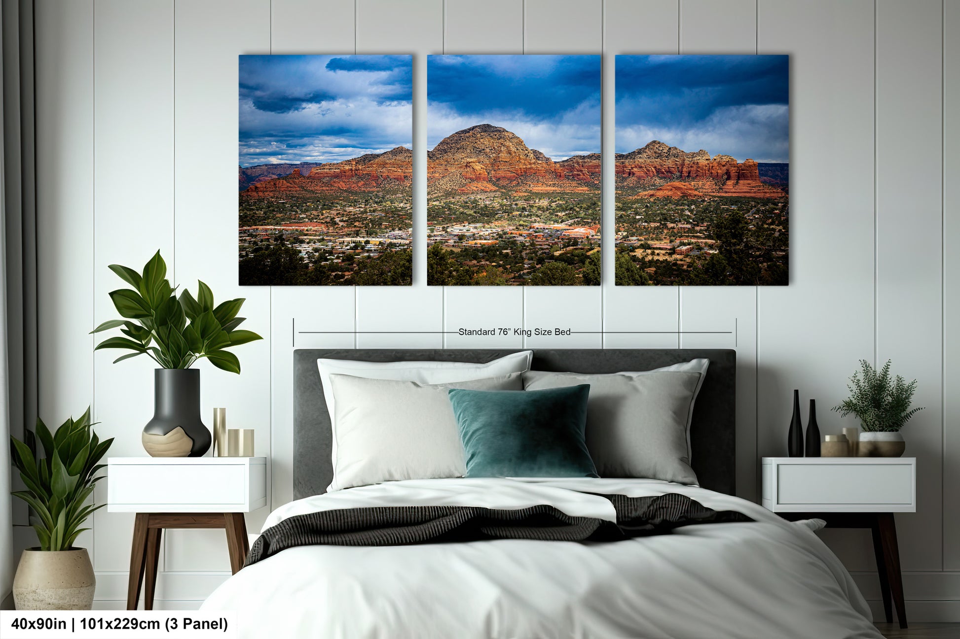 a bed room with a neatly made bed and two pictures on the wall