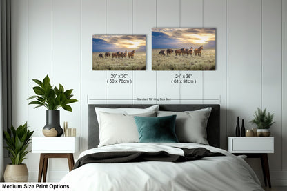 a bedroom with two pictures of horses on the wall