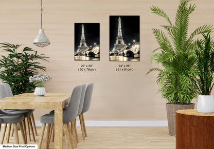 a dining room with a table and chairs and a picture of the eiffel