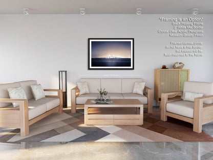 a living room filled with furniture and a painting on the wall