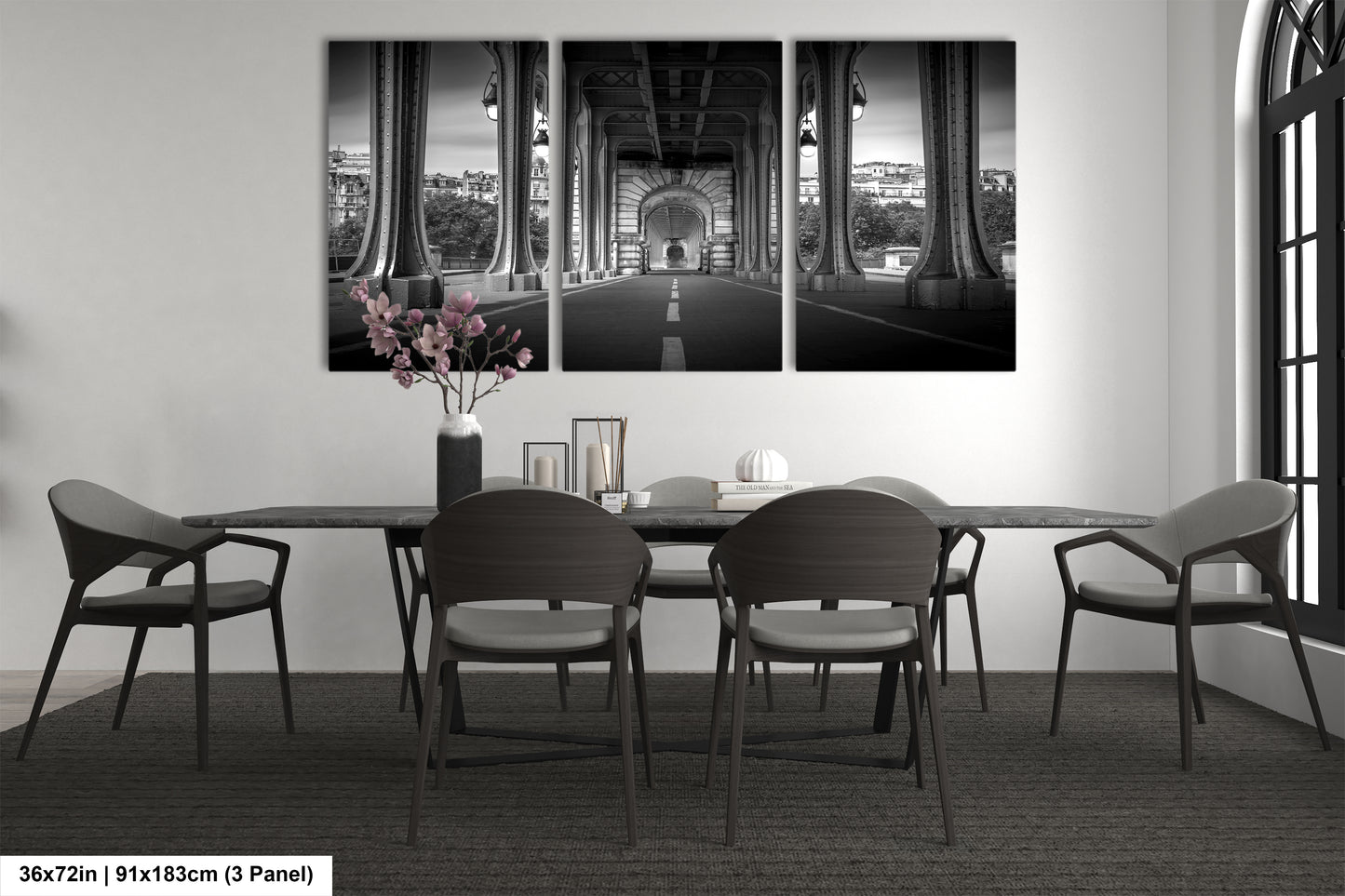 a black and white photo of a dining room