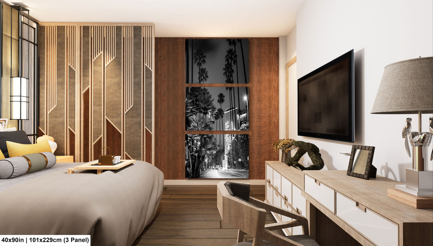 a bedroom with a large bed and a flat screen tv
