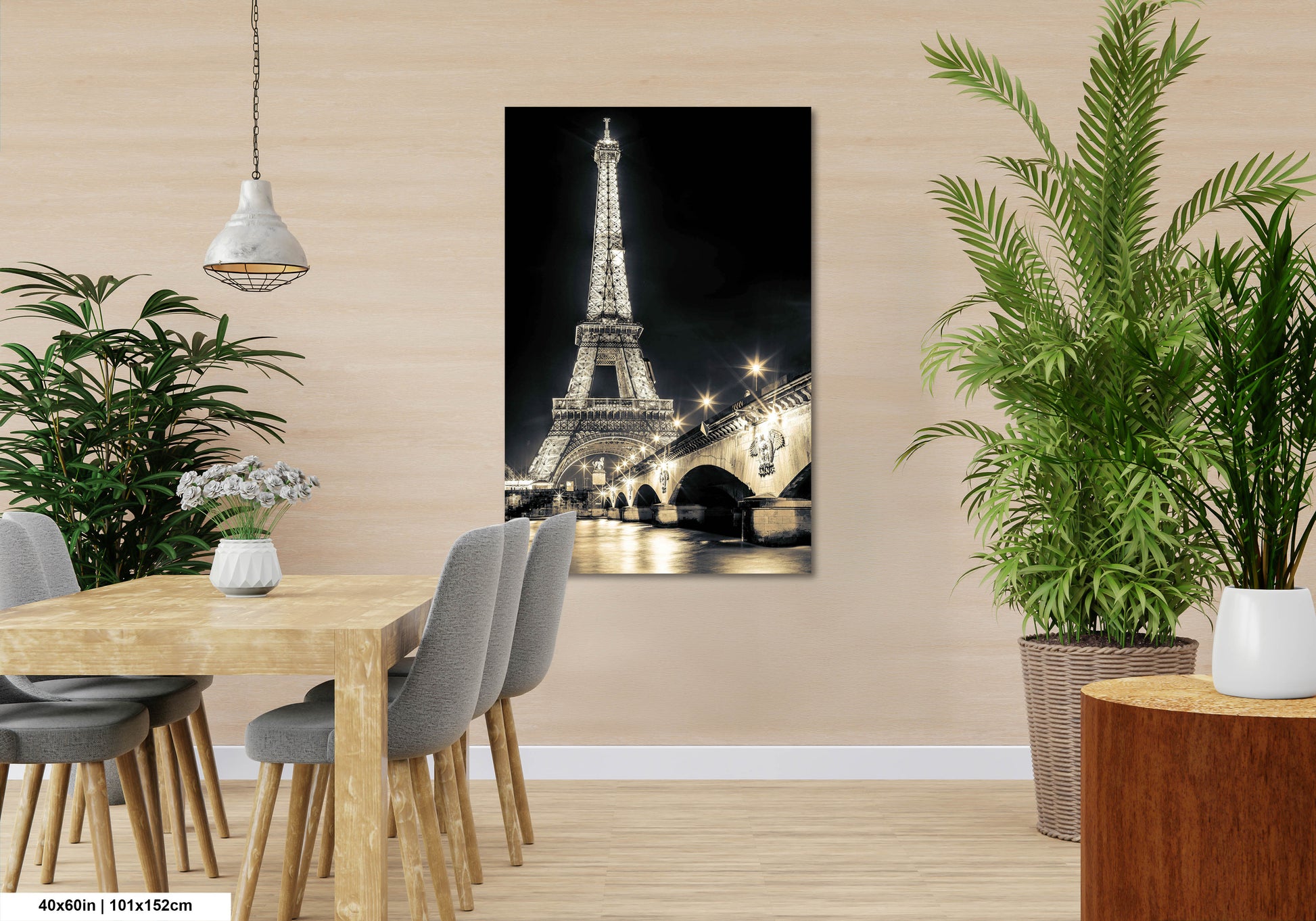 a room with a table and chairs and a picture of the eiffel tower