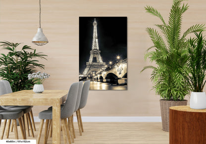 a room with a table and chairs and a picture of the eiffel tower