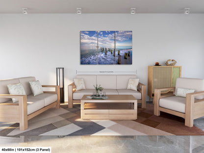 a living room filled with furniture and a painting on the wall