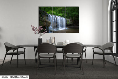 a dining room table with a waterfall in the background