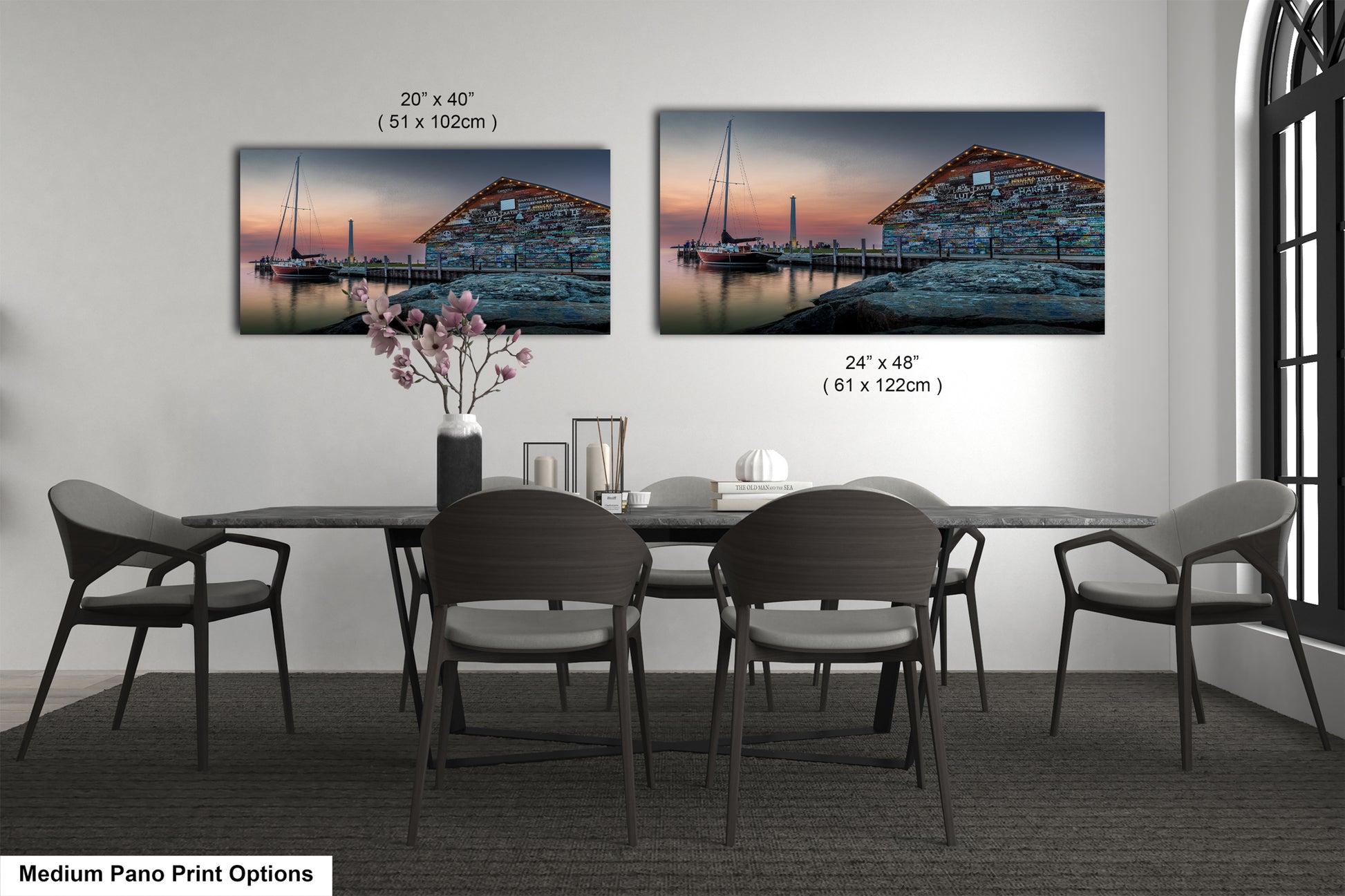 a bedroom with a bed and nightstands, along with two framed prints of a seascape displayed on the wall above the bed.