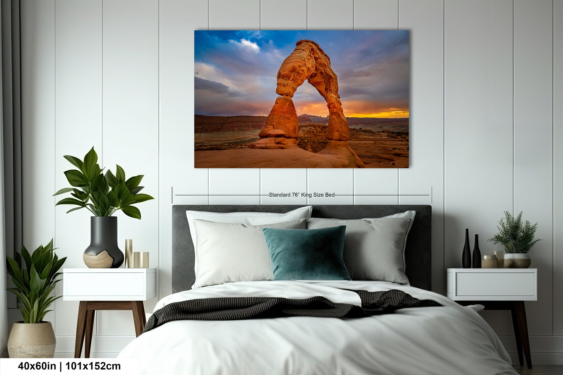 a bed room with a neatly made bed and a painting on the wall