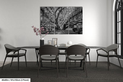 a black and white photo of a dining room table
