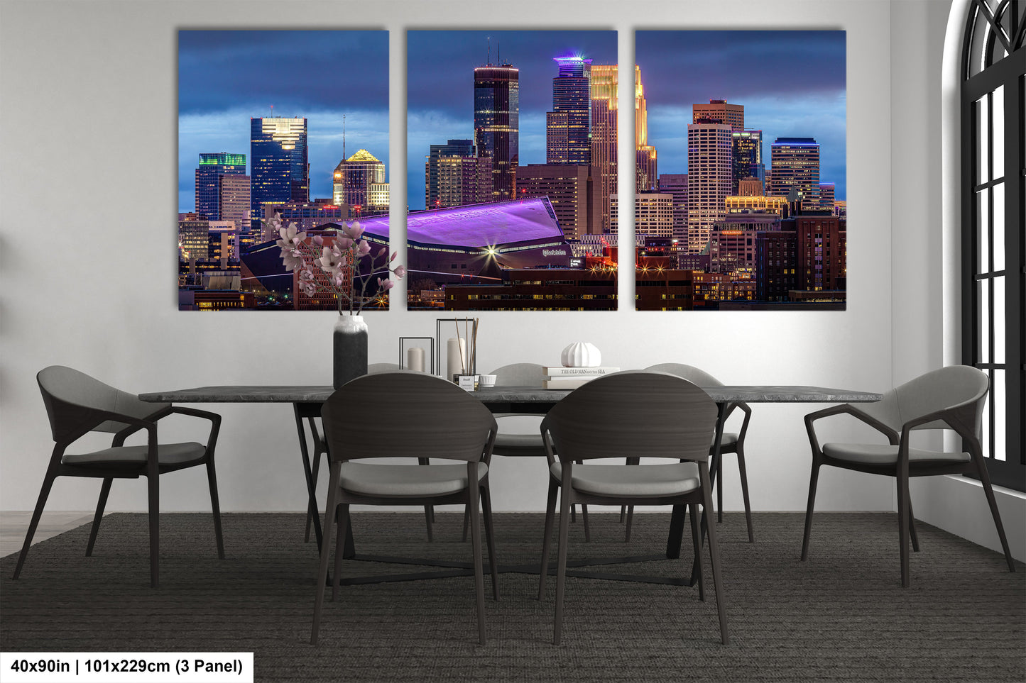 a dining room table with four chairs and a cityscape in the background