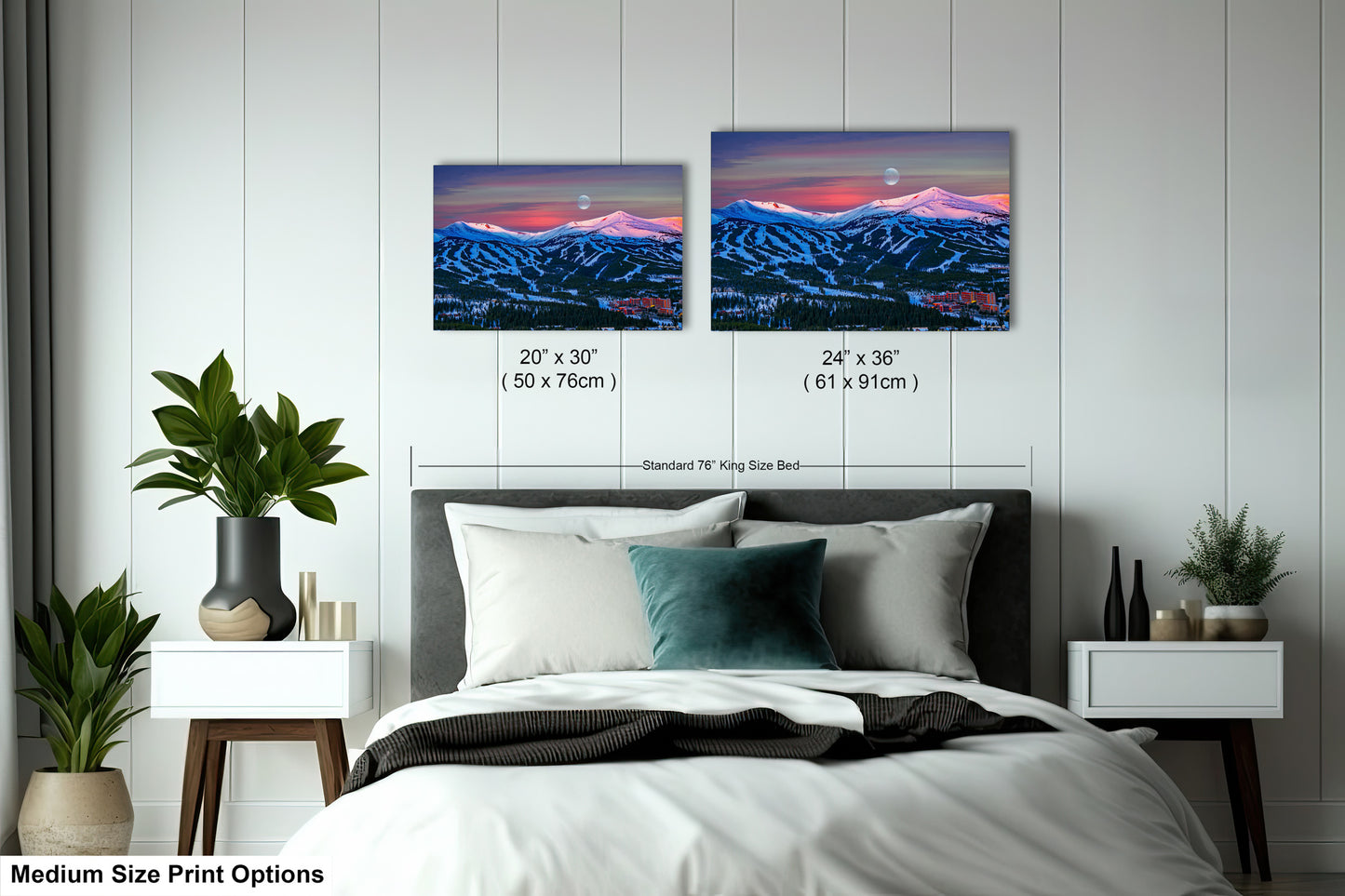 a bedroom with a bed and two pictures on the wall