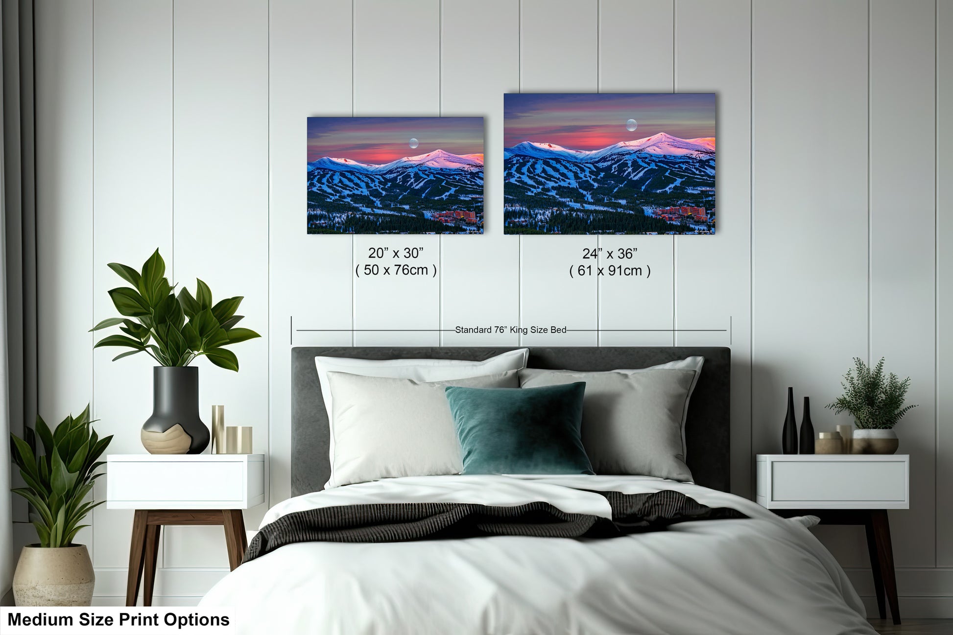 a bedroom with a bed and two pictures on the wall