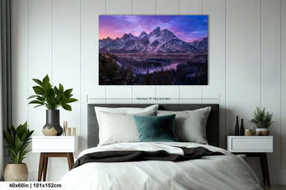 a bedroom with a bed and a painting on the wall