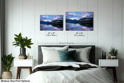 a bed room with a neatly made bed and two pictures on the wall