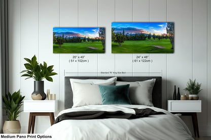 a bedroom with a large bed and two pictures on the wall