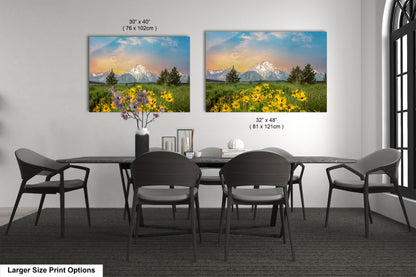 a dining room table with chairs and a vase of flowers