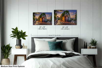 a bed with two pictures on the wall above it