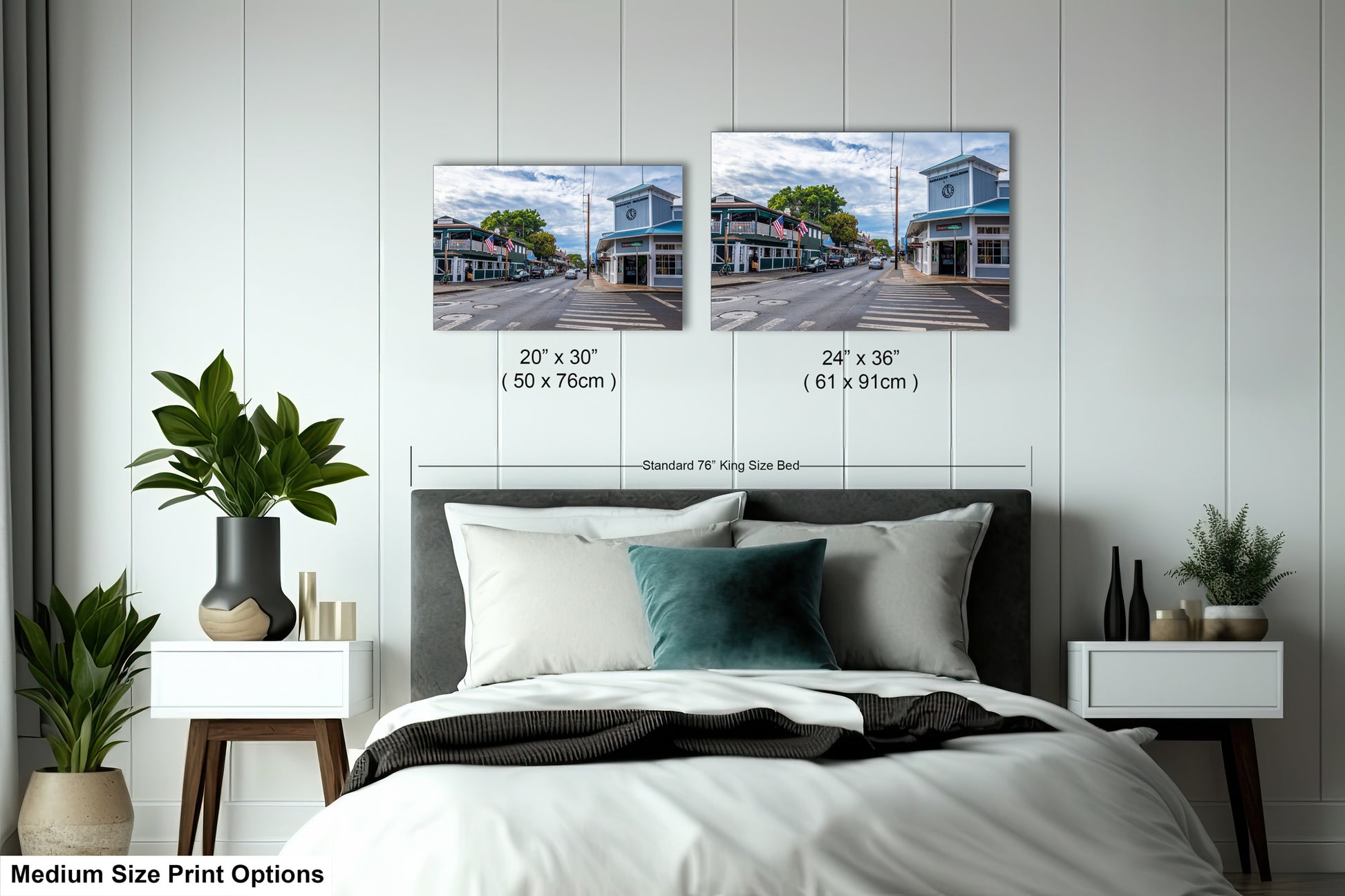 a bedroom with a bed and two pictures on the wall