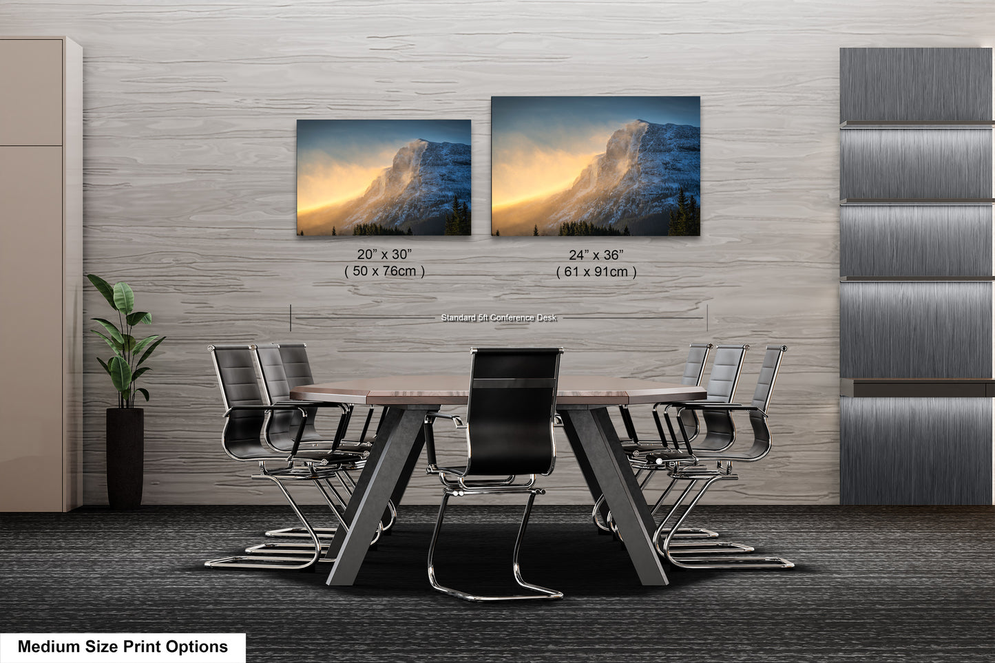a dining room table with four chairs and two pictures on the wall