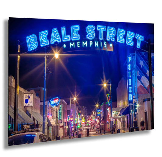 a city street at night with neon signs
