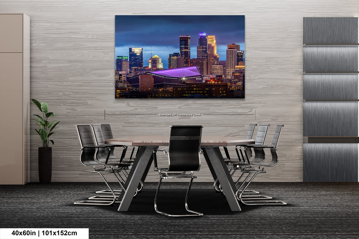 a dining room table with chairs and a painting on the wall