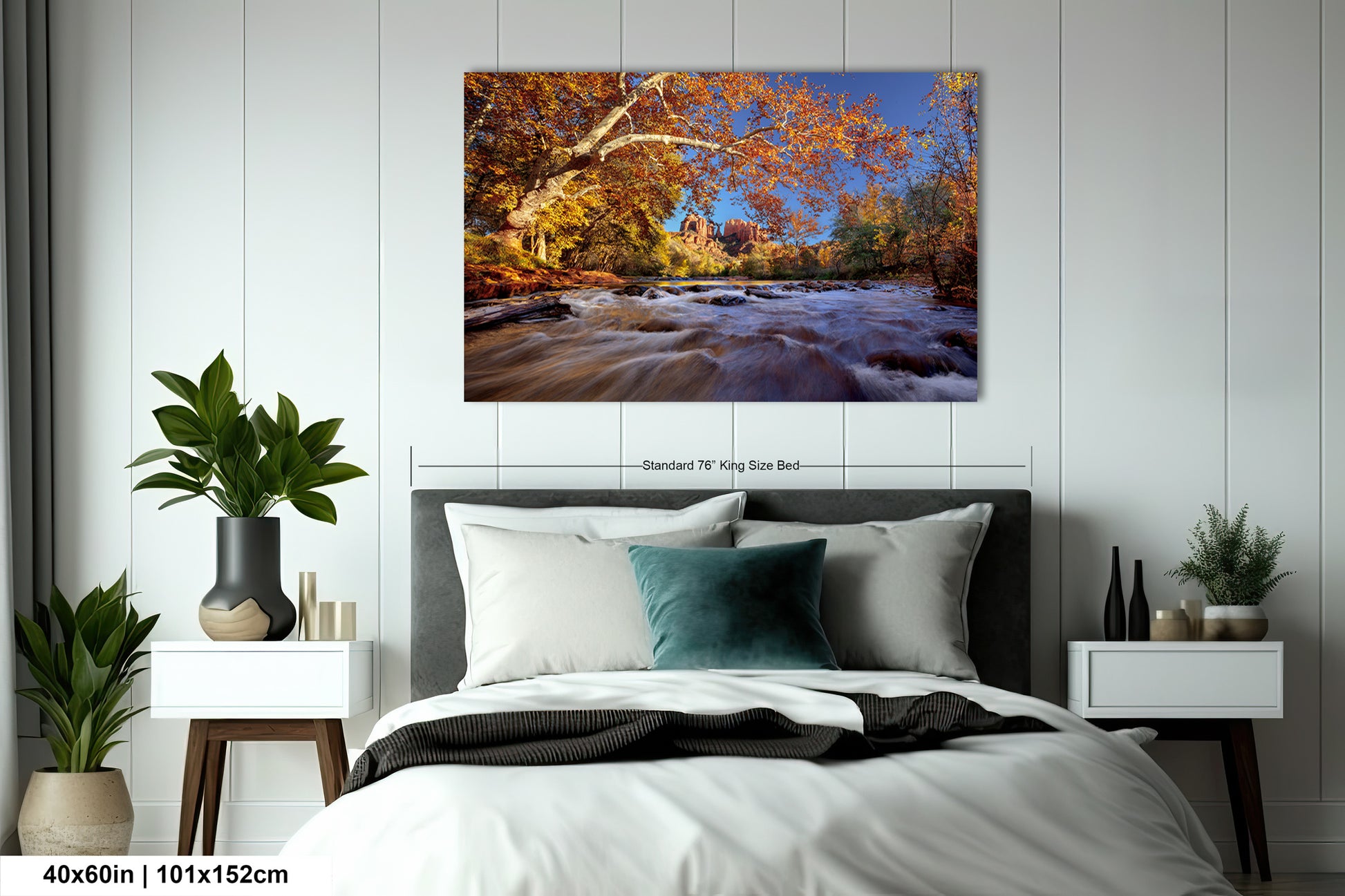 a bedroom with a bed and a painting on the wall