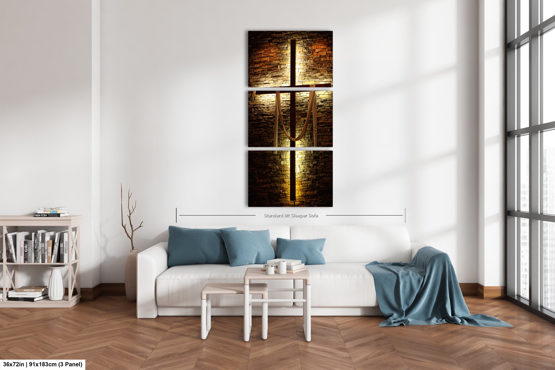 a living room with a white couch and a painting on the wall